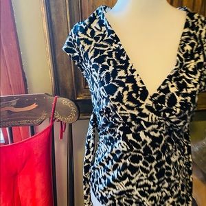 Adorable top could be paired with a black skirt or jeans